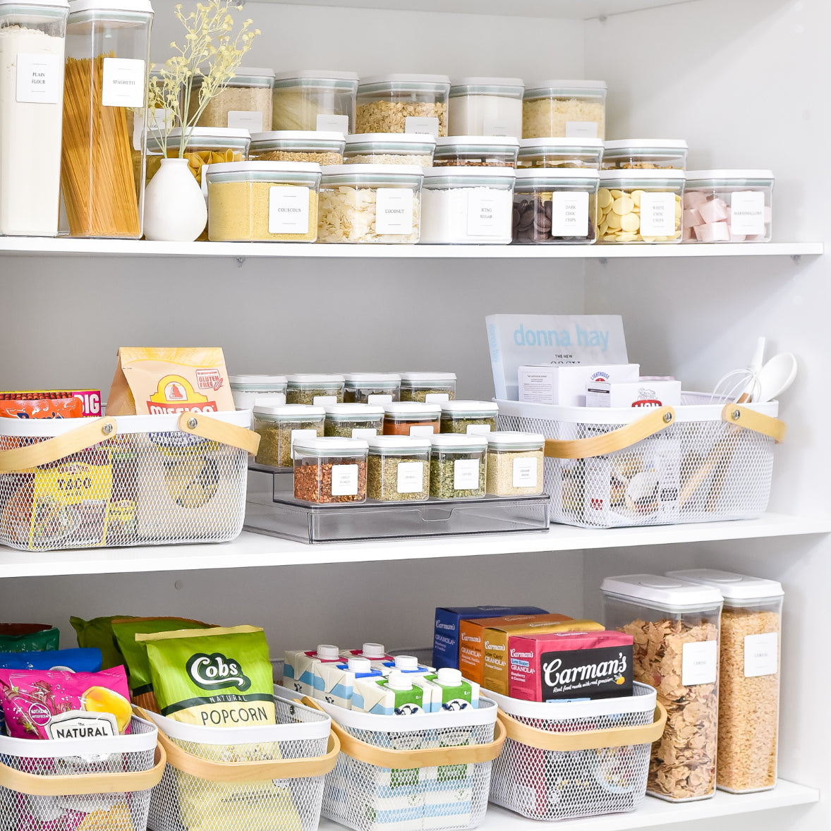 Home organisation bundles featuring clear pantry jars, spice racks, and white mesh storage baskets on shelves.
